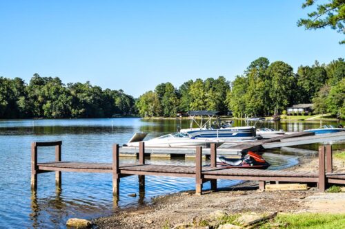 Boats docked at Bear Creek Marina on Jackson Lake, near the covered patio where a family reunion at Jackson Lake is hosted
