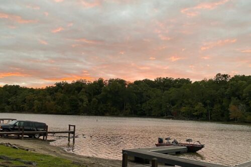 Sunset over the waterfront at Bear Creek Marina, the event space used for a family reunion at Jackson Lake in Mansfield, Georgia