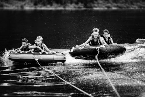 Tubing on Jackson Lake near Bear Creek Marina, a lake activity families add to a family reunion at Jackson Lake